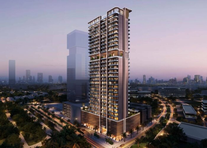 Luxury high-rise residential tower at dusk with illuminated balconies, modern design, palm lined roads and city skyline views
