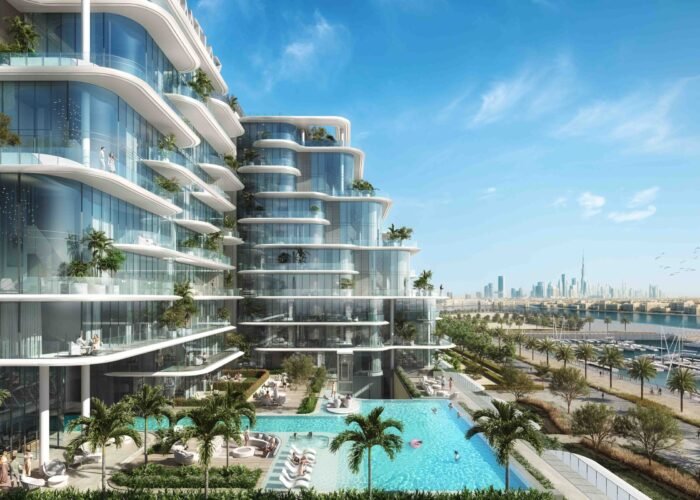 Luxury waterfront apartments with curved glass balconies, infinity pool, palm trees and Dubai skyline views luxury living