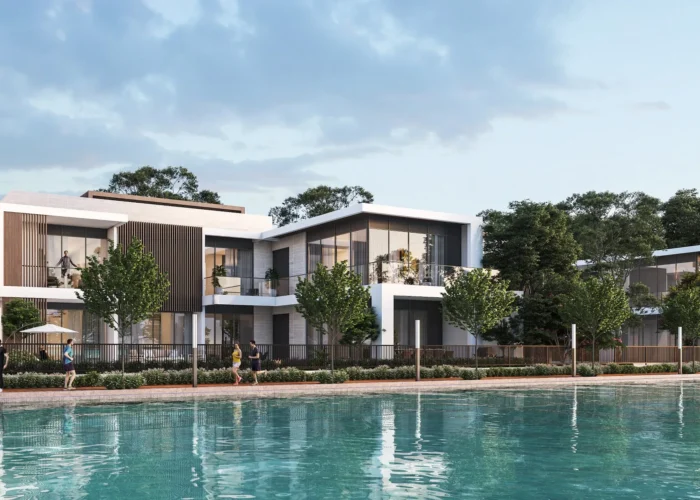 Modern waterfront villas with architecture, landscaped gardens and serene lagoon views in luxury residential community