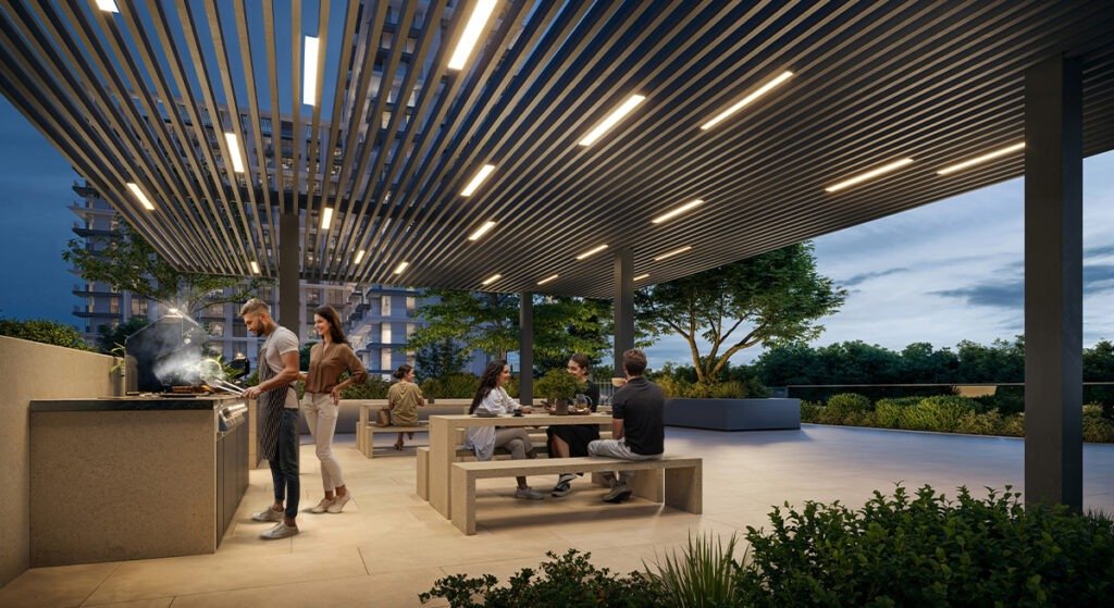 Residents enjoying outdoor BBQ lounge with modern seating, pergola lighting, landscaped greenery and community living space