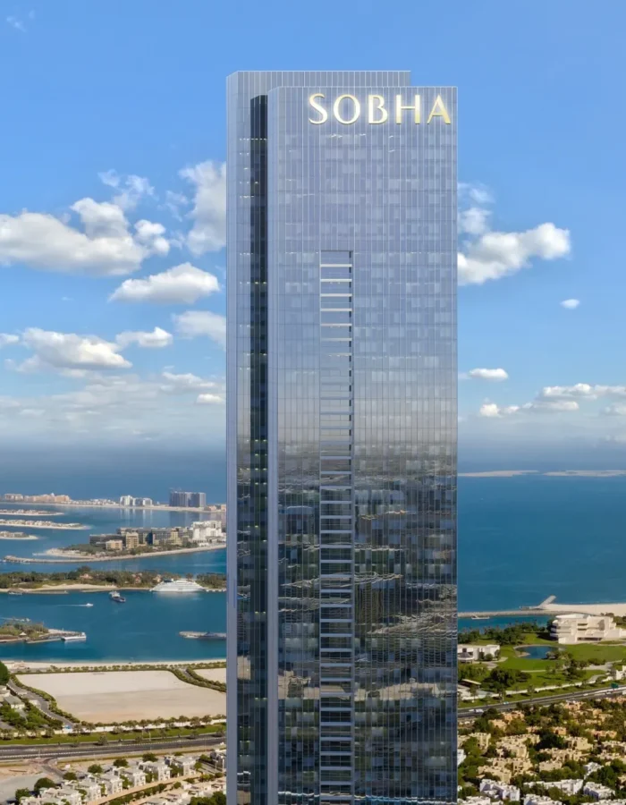 Sobha luxury high-rise tower with glass facade overlooking Dubai waterfront, blue sea views, premium residences and skyline surroundings