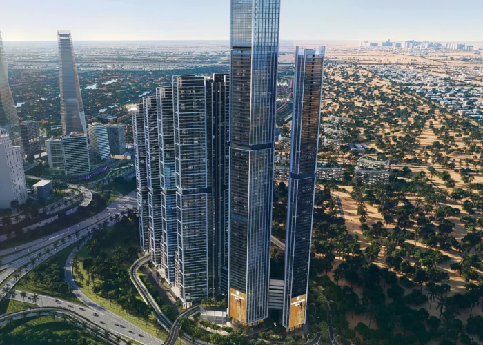 Aerial view of modern luxury high-rise towers with glass facades, landscaped roads and green surroundings in Dubai city view