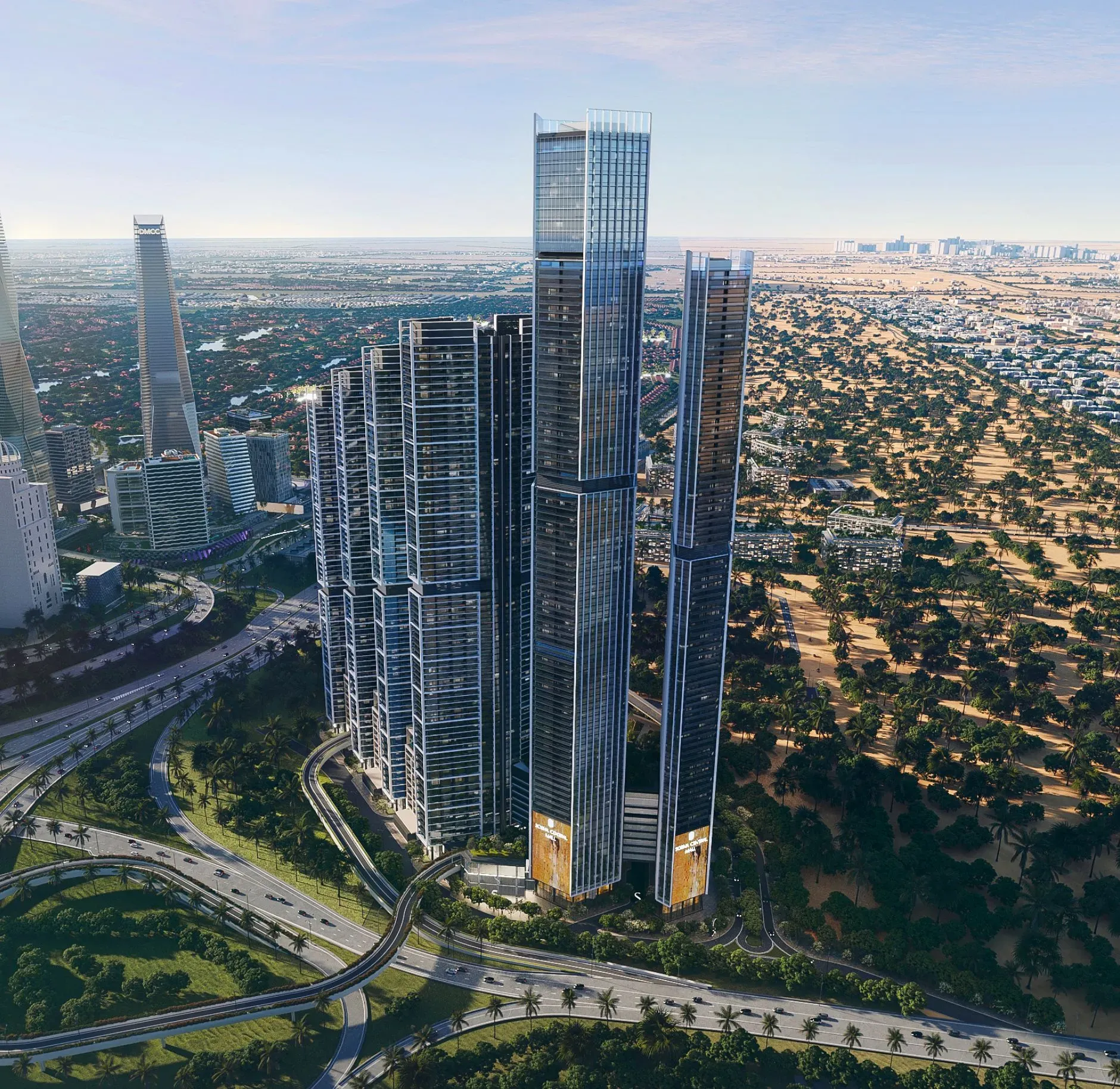 Aerial view of modern luxury high-rise towers with glass facades, landscaped roads and green surroundings in Dubai city view
