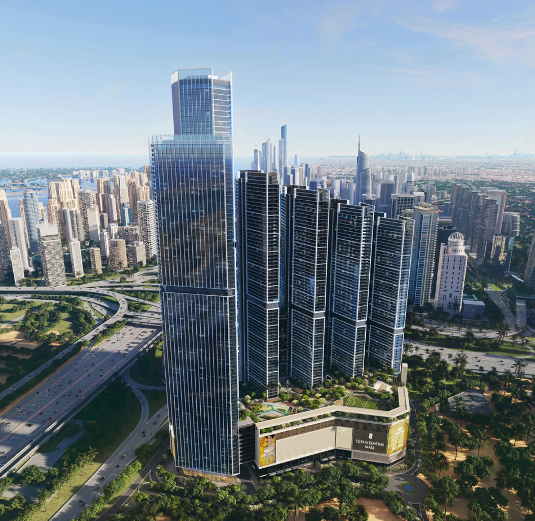 Aerial view of luxury high-rise towers in Dubai with modern glass facades, landscaped podium, highways and city skyline views