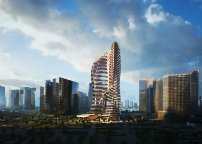 Iconic curved luxury tower with flowing balconies, modern glass facade and prominent city skyline backdrop views now