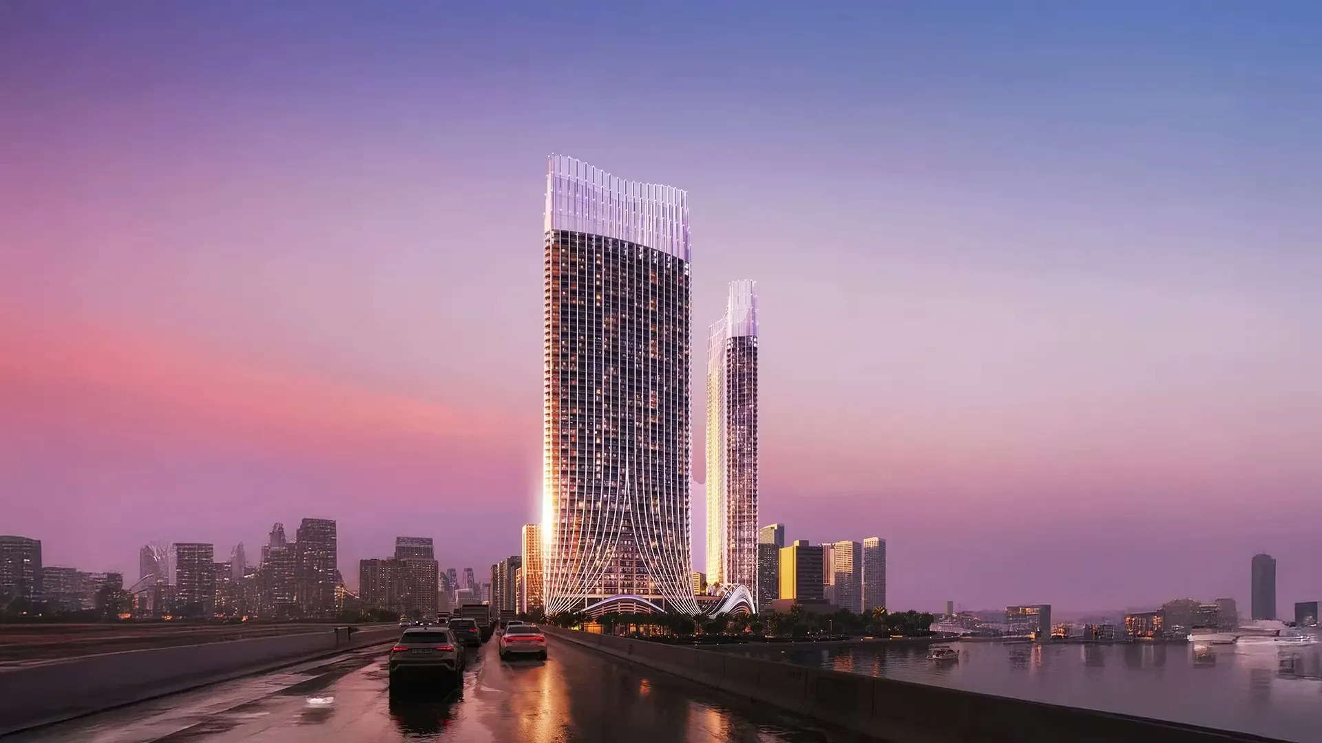Luxury waterfront towers at sunset with illuminated facades, road access, river reflections and modern city skyline views