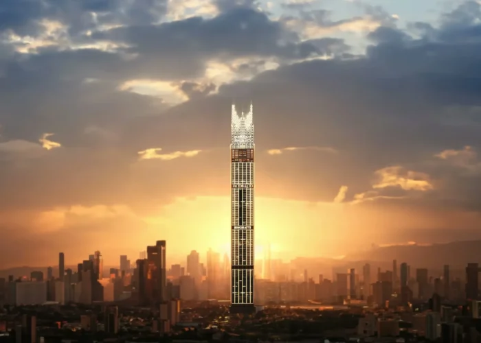 Iconic luxury skyscraper rising at sunset with glowing facade, dramatic clouds and expansive modern city skyline backdrop