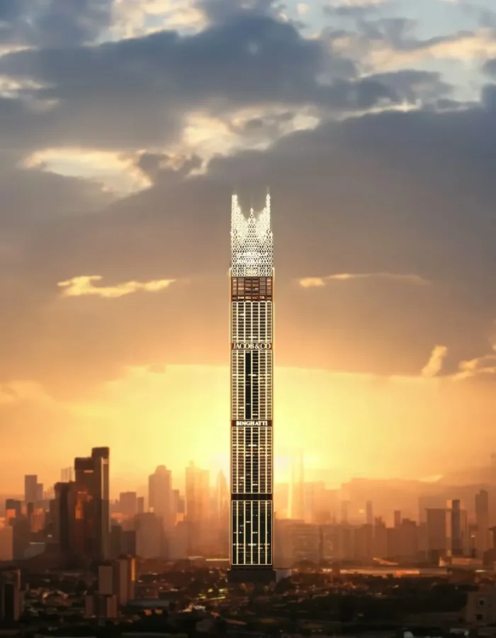 Iconic luxury skyscraper rising at sunset with glowing facade, dramatic clouds and expansive modern city skyline backdrop
