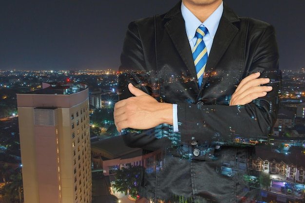 Dubai city skyline at night illuminated with iconic skyscrapers, vibrant city lights, and premium real estate atmosphere